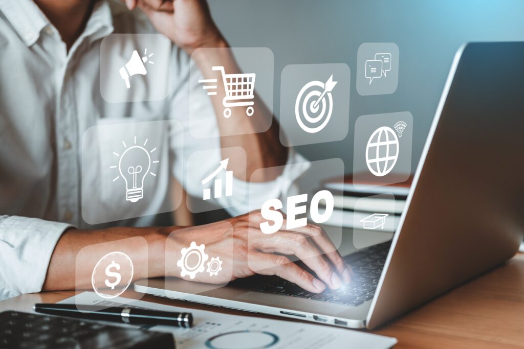 Photographer Researching Seo for Photography Websites on a Laptop with Digital Marketing Icons Overlayed