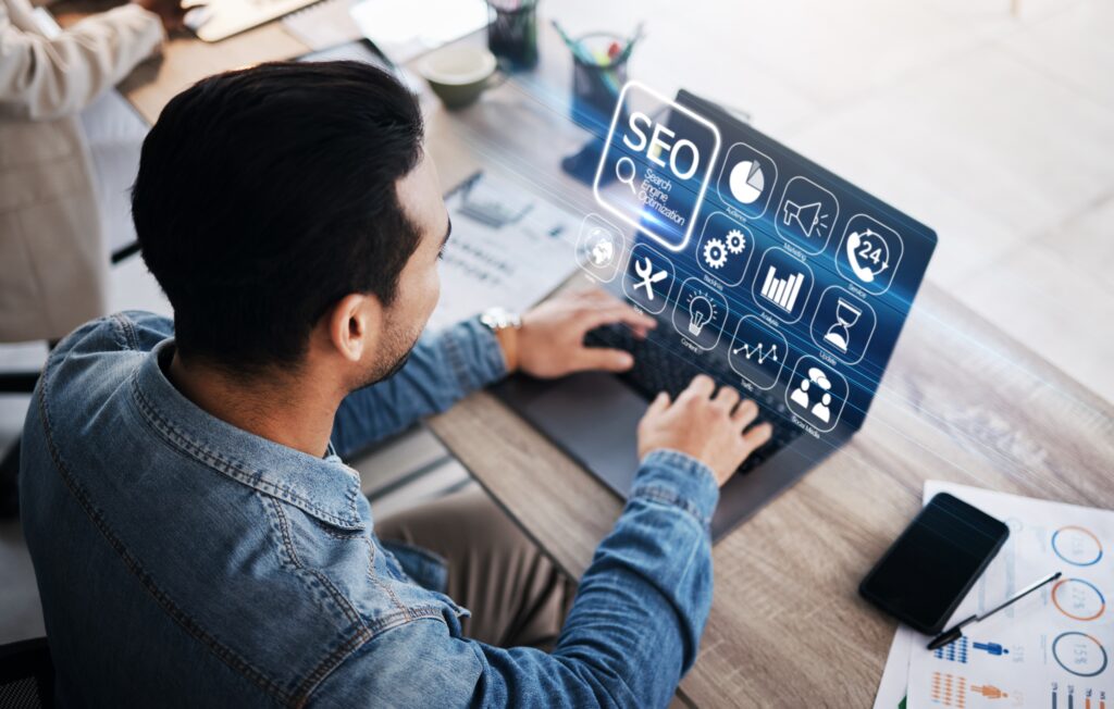 a Person Working on a Laptop with a Digital Interface Displaying Seo Icons Emphasizing Why Seo for Photographers Matters for Local Businesses