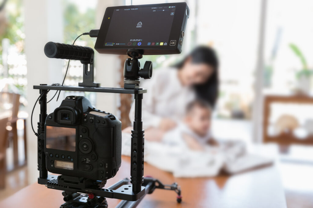 Professional Camera Setup Capturing a Mother and Child During a Photoshoot Representing Pr for Childrens Photographers and Building Trust with Families