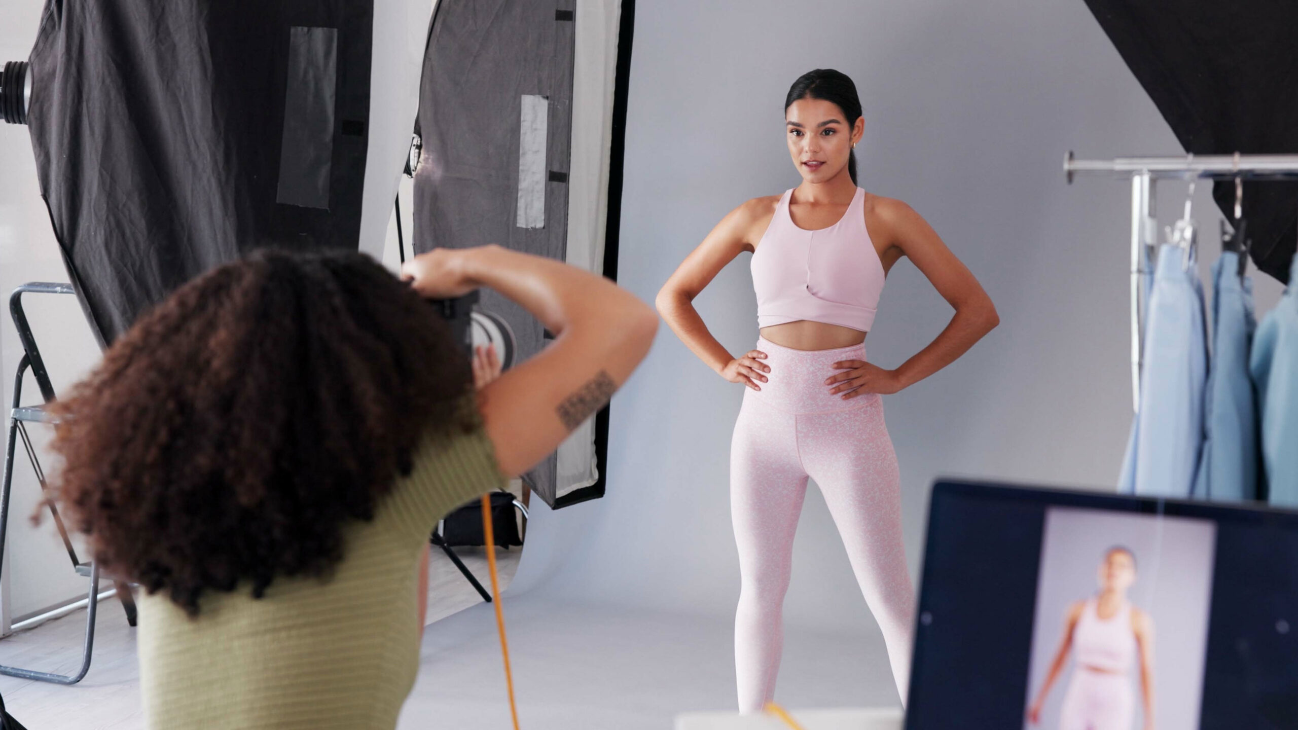 Branding photographer capturing a lifestyle studio portrait of a woman in athletic wear, illustrating how SEO for branding photographers helps them get found, build trust, and attract more clients.