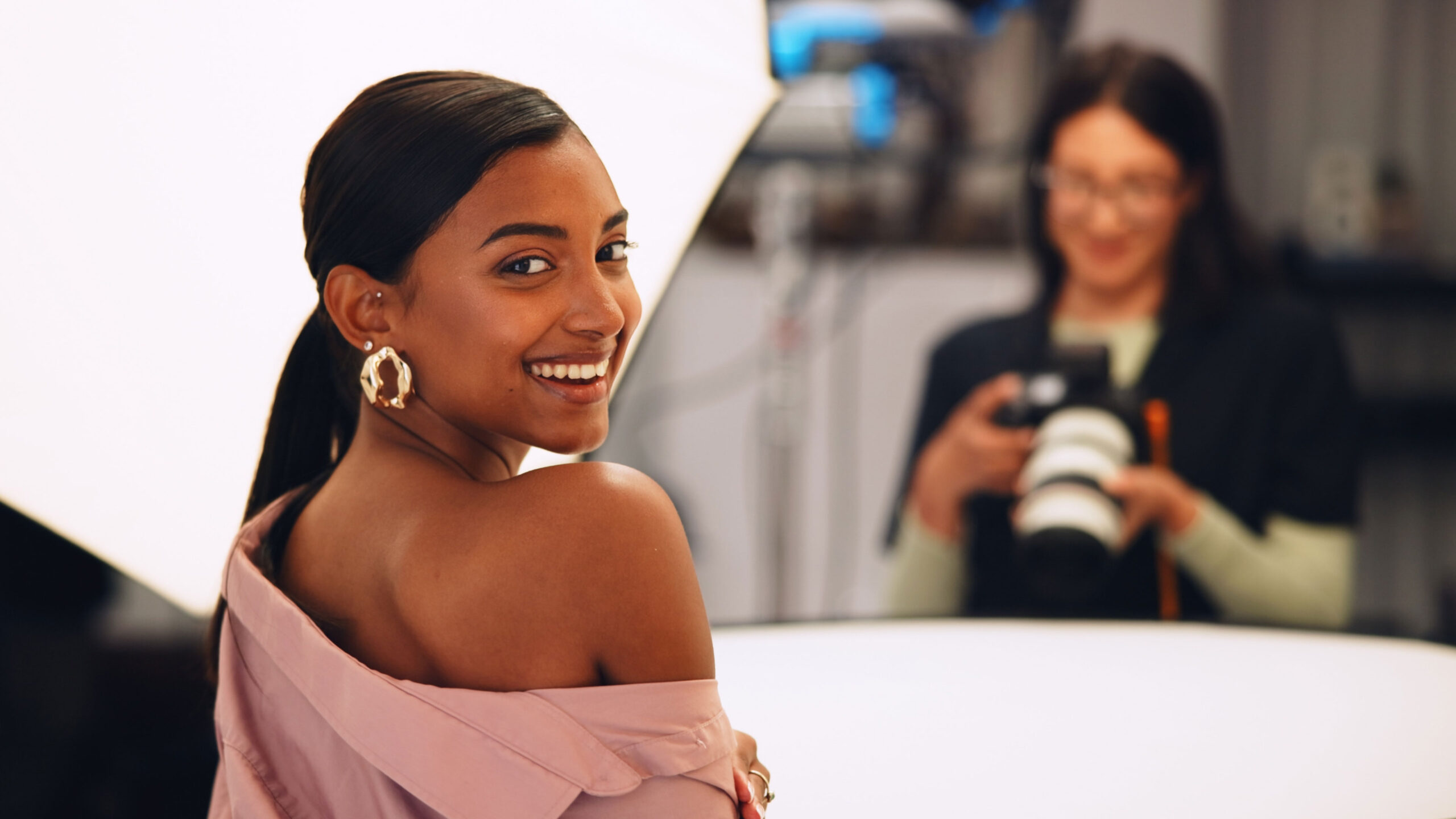 Photographer capturing senior portraits in a studio, representing SEO for senior photographers who want to get found and booked online.