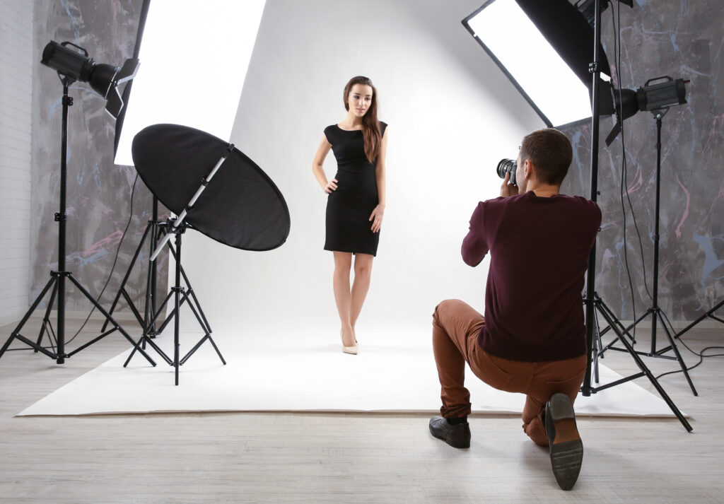 Photographer Capturing a Model in a Studio with Lighting Equipment Representing Content Ideas for Instagram for Photographers