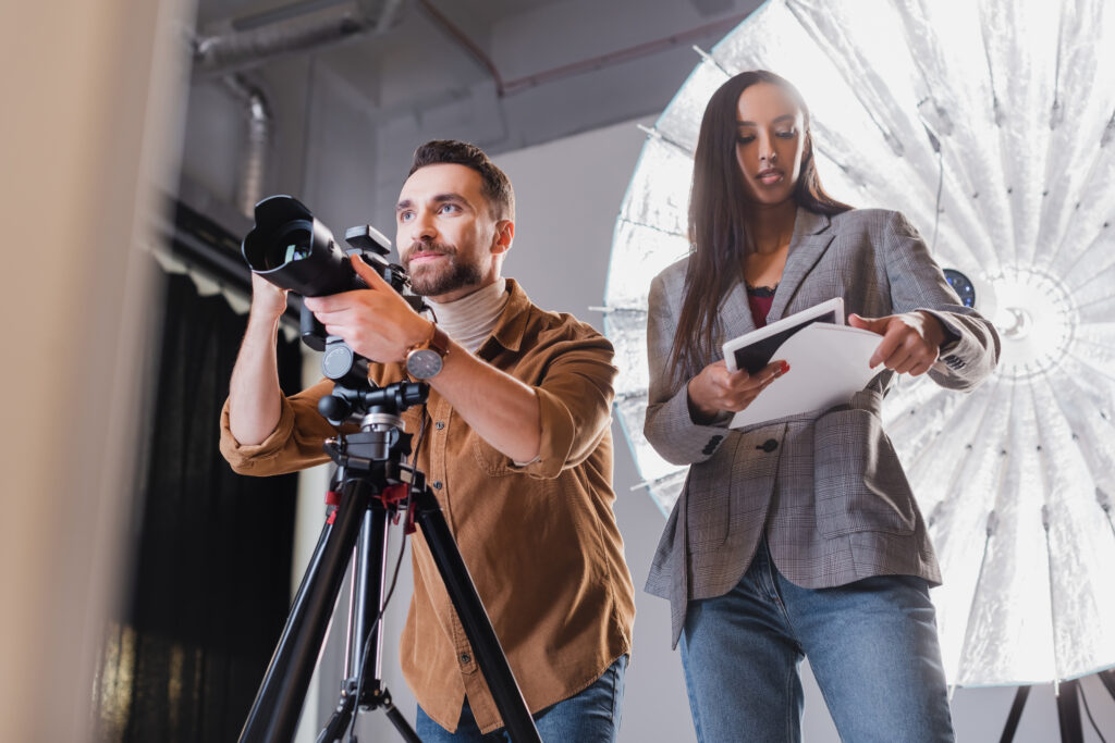 Professional Photographers Working in a Studio Representing How Showit Seo for Photographers Helps Showcase Expertise Online