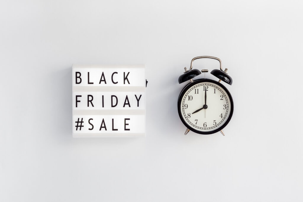 Black Friday sale lightbox sign with alarm clock, symbolizing urgency for Photography Black Friday Deals.