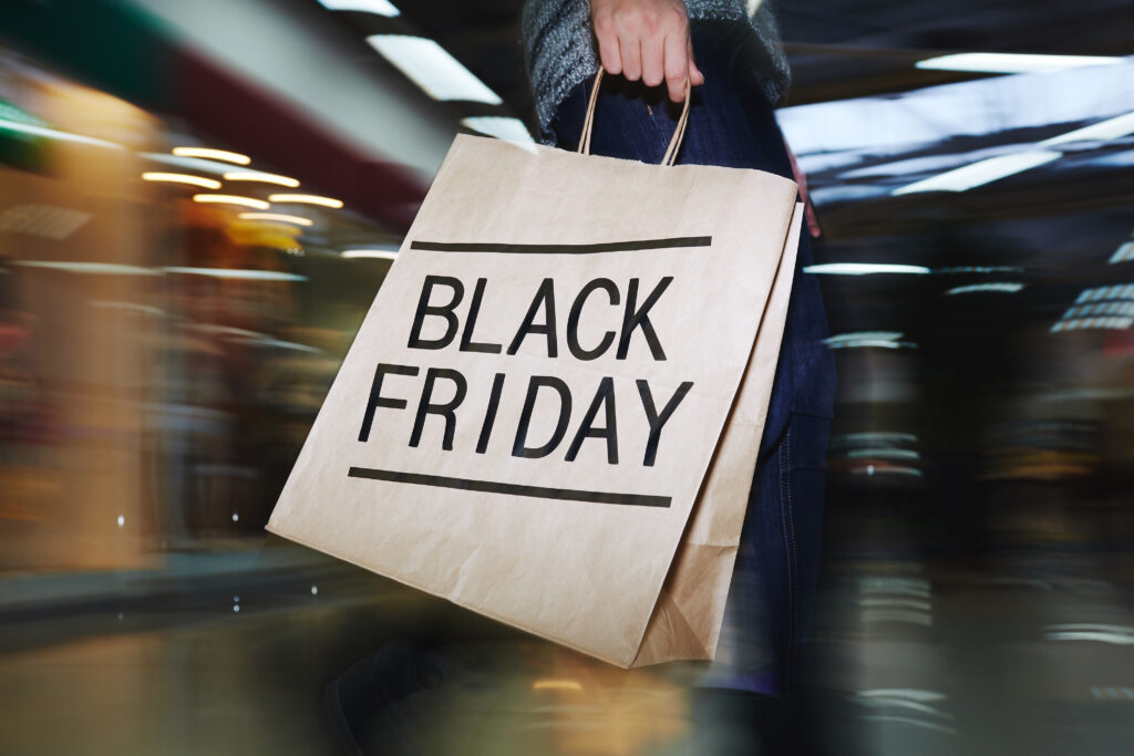 Paper shopping bag with bold Black Friday text, representing Photography Black Friday Deals and sales opportunities for photographers.