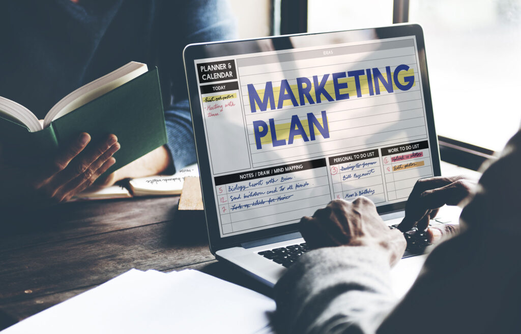 Close-up of a laptop screen showing a digital marketing plan with notes and tasks, symbolizing marketing blogs for photographers to grow client bookings.