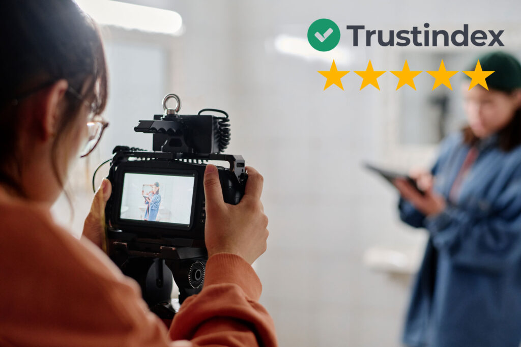 Close-up of a photographer filming with a professional camera, paired with Trustindex five-star ratings to represent reviews about photographers.